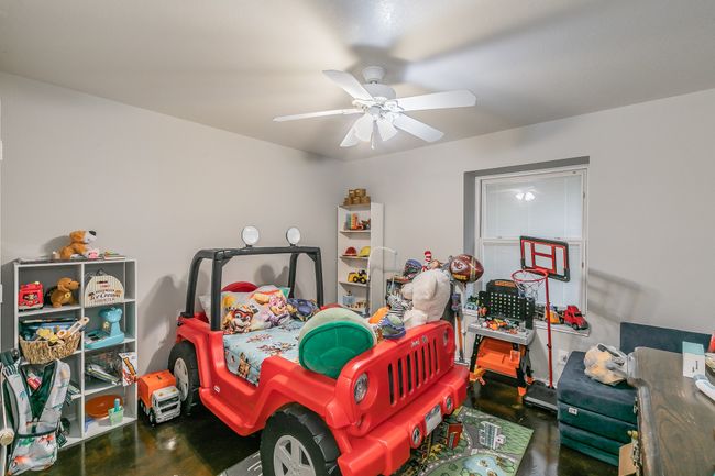 Unit 4904 Second Bedroom featuring ceiling fan | Image 36