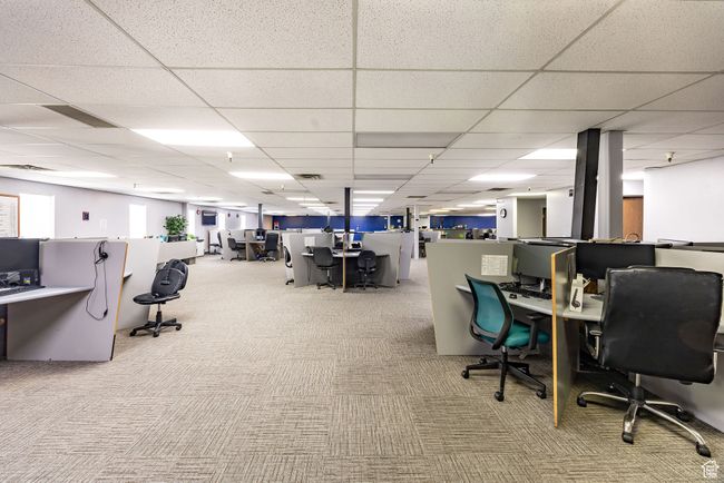 Carpeted home office featuring a drop ceiling | Image 10