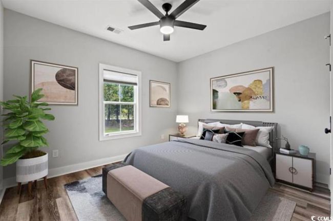 Bedroom featuring wood finished floors, baseboards, and a ceiling fan | Image 21