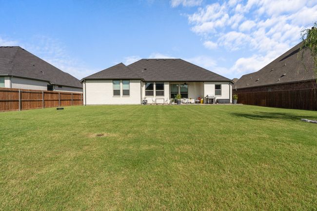 Back of property with a fenced backyard, a patio, and ceiling fan | Image 26