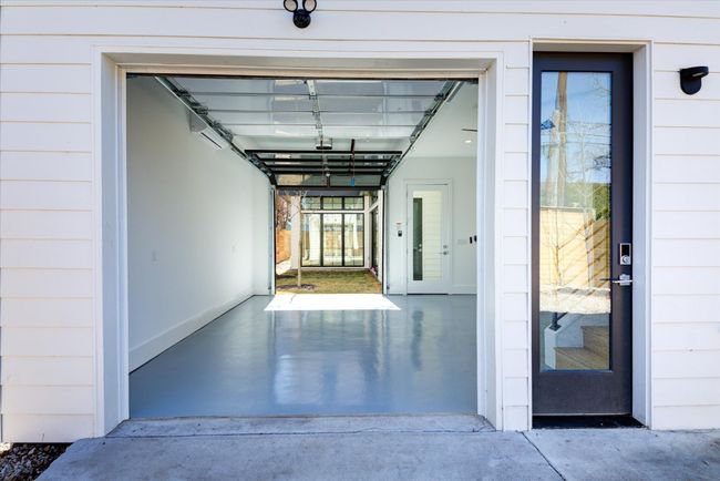 Double street access! If you operate your business out of the home, the climate-controlled garage / flex space has access to Santa Rosa St, making it easy for clients or customers to stop by without having to enter the main part of the home. SEE VIRTUAL TOUR LINK WITH INTERACTIVE FLOOR PLAN AND 3D WALK THRU. | Image 29