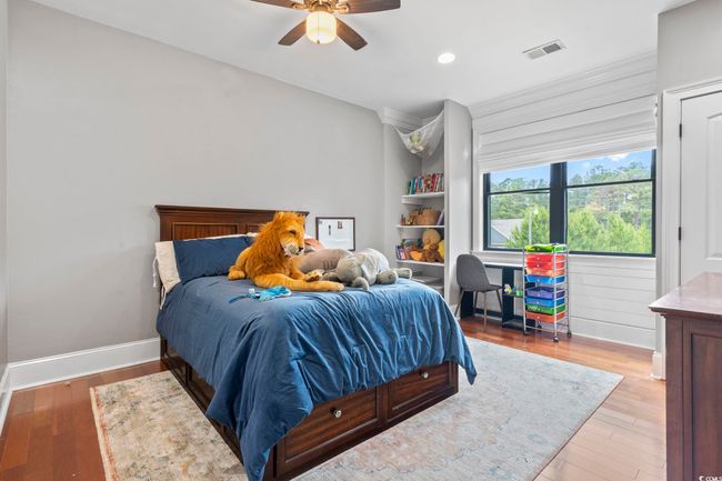 Bedroom with wood finished floors, recessed lighting, baseboards, and a ceiling fan | Image 24