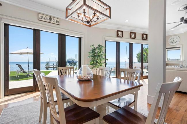 Dining area with window walls overlooking the intracoastal bay waters | Image 27