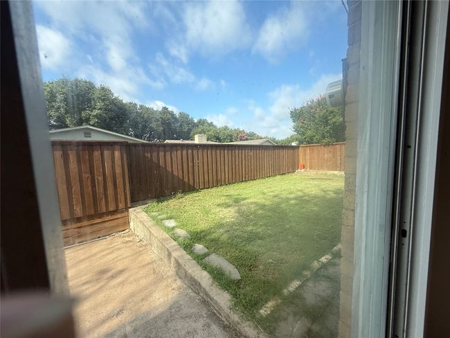 View of fenced backyard | Image 20