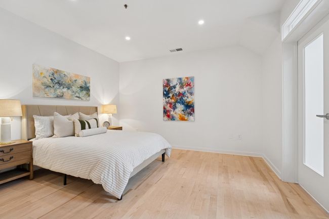 Soaring ceilings and natural light make this bedroom feel even more expansive—your personal oasis at the end of the day. | Image 19