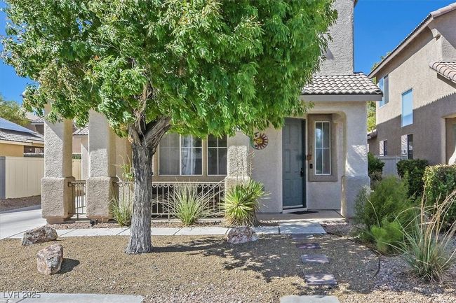 View of front of property featuring stucco siding, fence, and a tile roof | Image 28