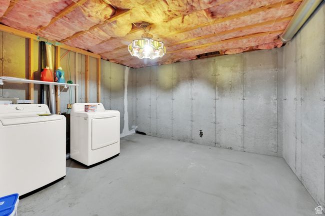 Unfinished basement with washing machine and dryer | Image 18