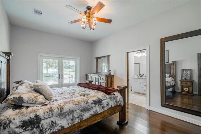 Here is the large master bedroom and bath. Notice the french doors that lead out to the porch. | Image 22