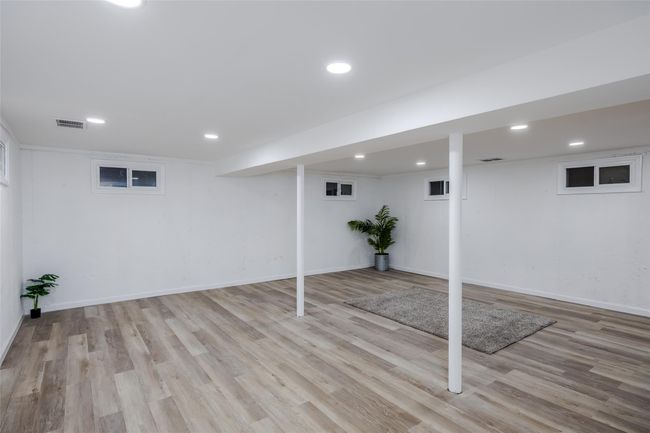 Unfurnished bedroom with a closet and light wood-type flooring | Image 28