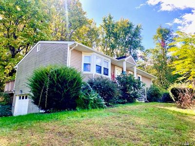 View of front of home featuring a front yard | Image 1