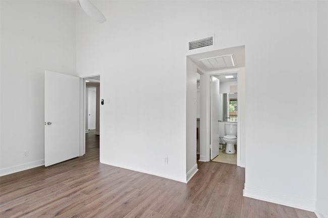 Downstairs bedroom with ensuite bath. | Image 10