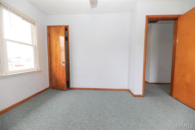 Empty room featuring carpet and baseboards | Image 12