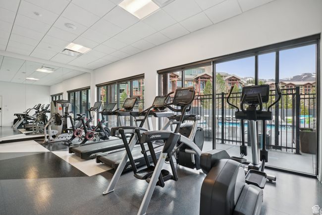 Gym featuring a healthy amount of sunlight and a drop ceiling | Image 37