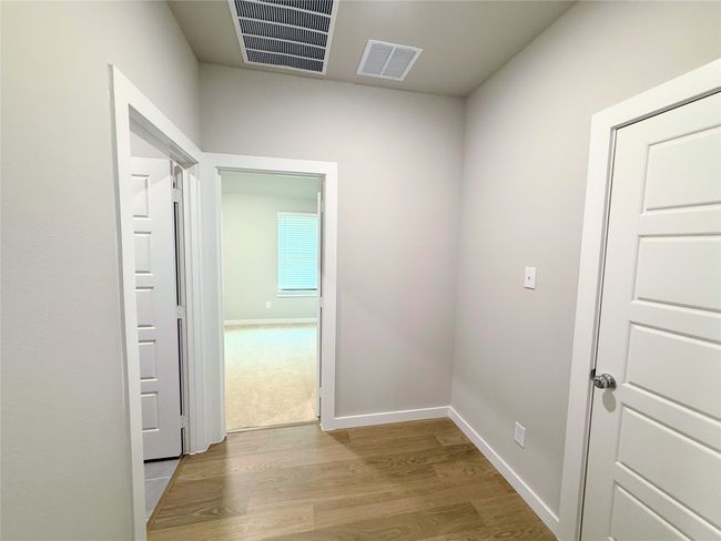 Corridor featuring wood finished floors and baseboards | Image 24
