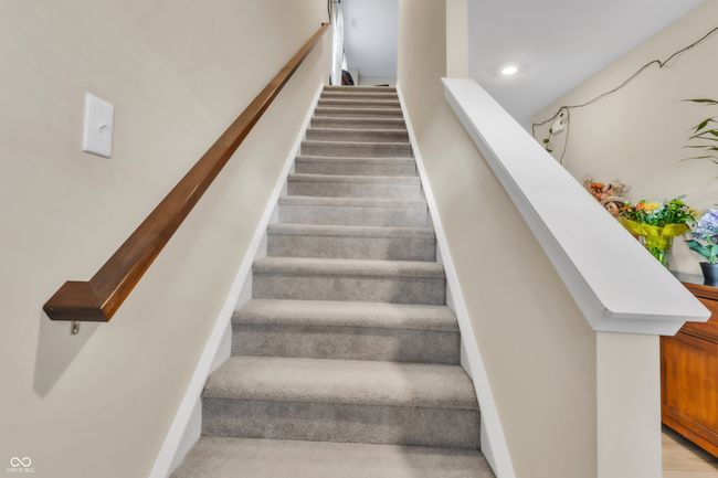 stairway with baseboards | Image 15