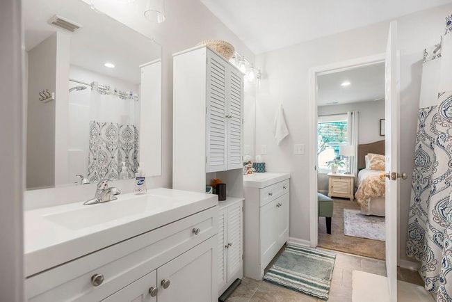 Full bathroom with connected bathroom, vanity, a shower with curtain, visible vents, and recessed lighting | Image 19