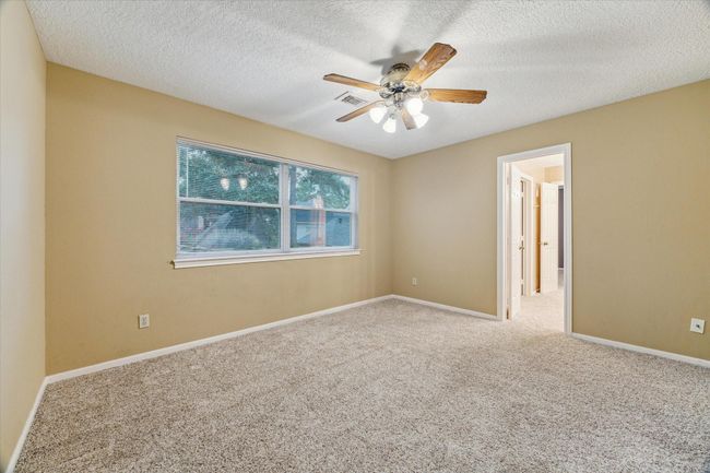 This 13’x11’ secondary bedroom overlooks the back yard and has a comfortably sized closet. | Image 26