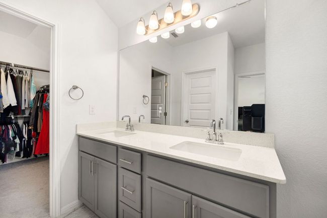 Bathroom with double vanity and a spacious closet | Image 23