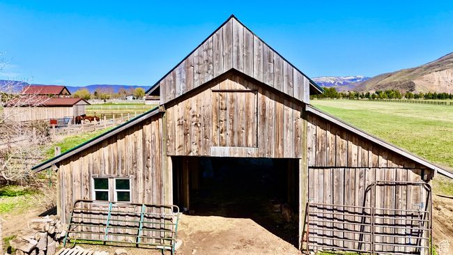 View of barn featuring a yard and a mountain view | Image 28