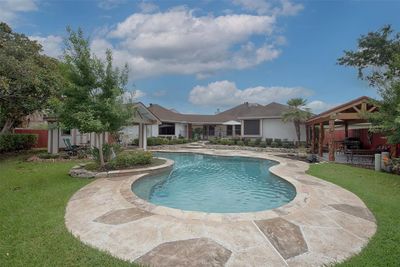 Gorgeous home with pool and amazing outdoor entertaining space. | Image 1