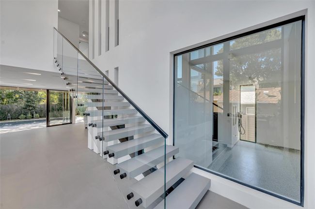 Viewing Window from the interior of the home into the garage, perfect for car enthusiasts. | Image 28