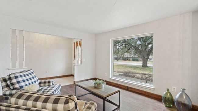 Living area with baseboards and light wood-style floors | Image 7