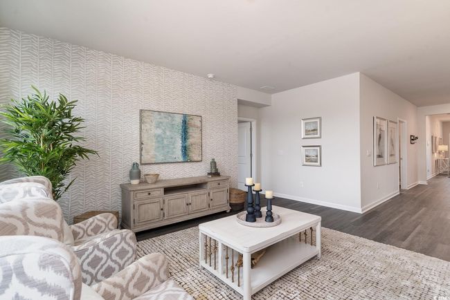 Living room featuring wallpapered walls and wood finished floors | Image 14