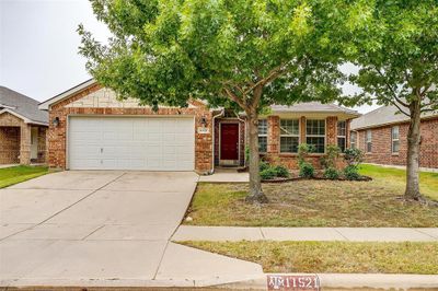 Ranch-style house with a front yard and a garage | Image 3