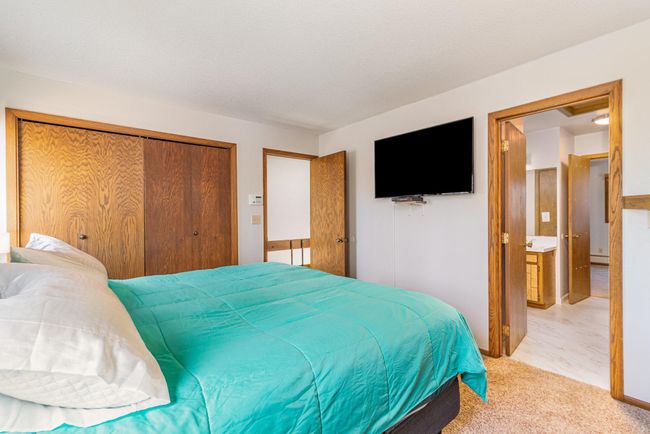 The primary bedroom features a large closet and access to the Jack & Jill full bathroom. There are cable jacks on both sides of the bathroom door allowing for options. | Image 23