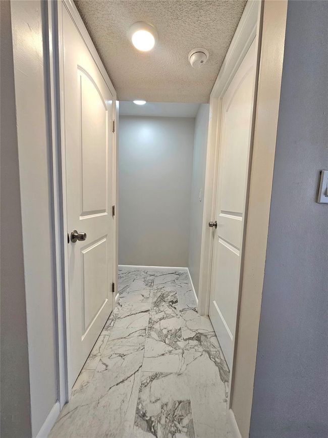 HALLWAY LEADING TO LAUNDRY, BEDROOM AND BATHROOM | Image 11