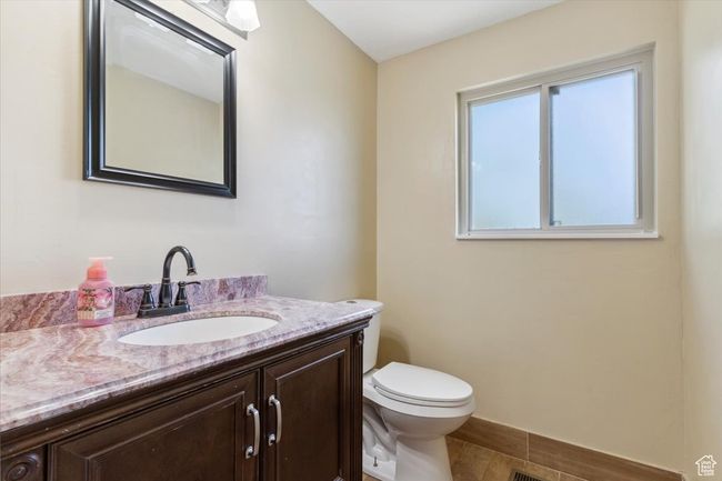 Half bathroom with vanity and toilet | Image 15