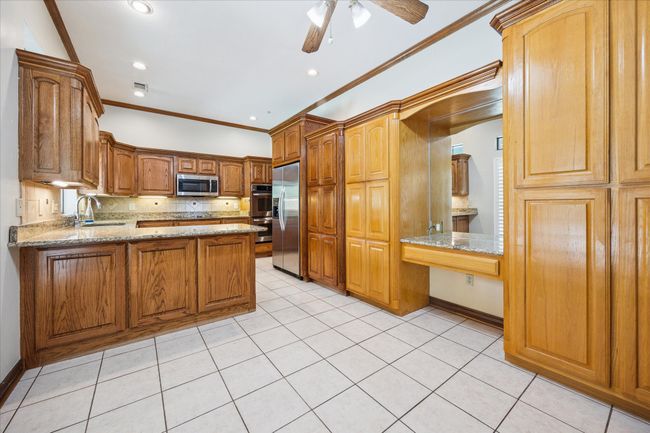 A built in desk provides a convenient workspace. | Image 19