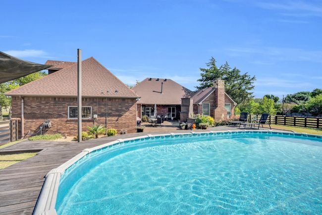 View of swimming pool featuring a deck | Image 30