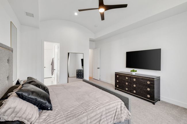 Bedroom with lofted ceiling, baseboards, carpet, ceiling fan, and recessed lighting | Image 19
