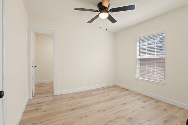 Entryway with light wood finished floors, ornamental molding, baseboards, and recessed lighting | Image 4