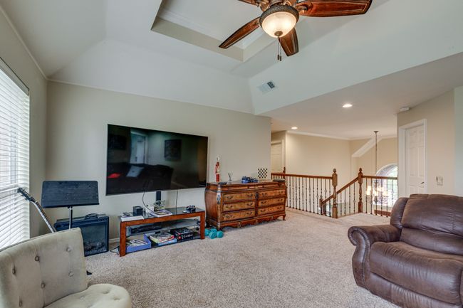 Living area with carpet and ceiling fan | Image 22