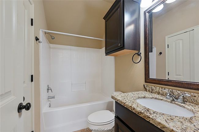 Bathroom featuring vanity, shower / tub combination, and toilet | Image 16