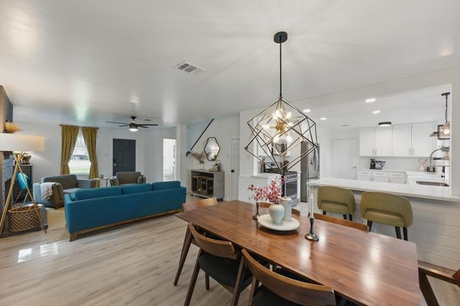 The dining area’s ample space allows for easy arrangement of furniture, perfect for any dining occasion. | Image 8