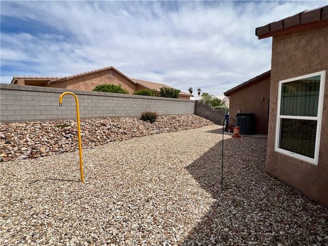 Fenced backyard with central air condition unit | Image 40