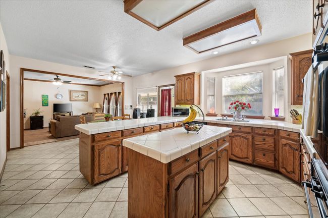 Center island is a perfect prep area to stage dinner. Plenty of space to enjoy cooking on the gas cooktop while the kiddos help chop the salad ingredients for a healthy addition to your evening meal without stepping on each other!. | Image 26