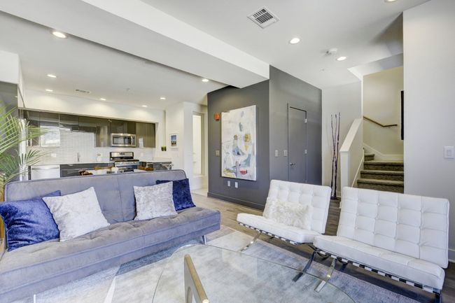 Living room featuring stairway, light wood-type flooring, and recessed lighting | Image 4