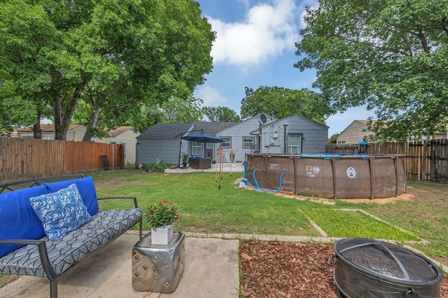 View of yard with an outdoor living space with a fire pit, a patio, and a gazebo | Image 18