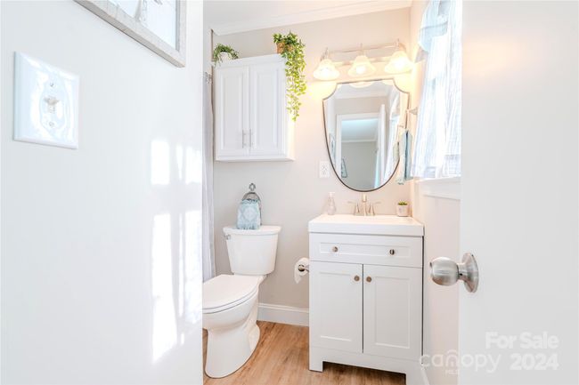 Updated bath includes built in storage | Image 22