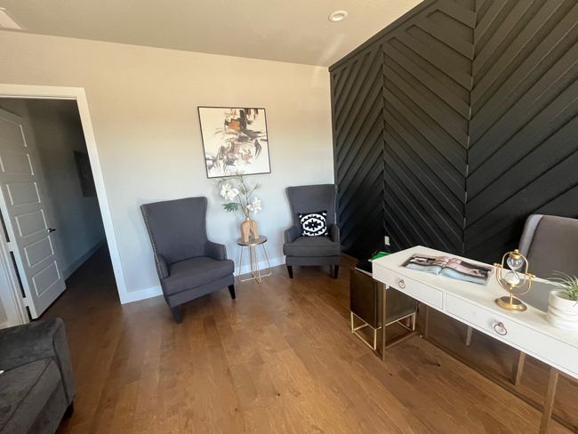 Office area featuring wood finished floors and baseboards | Image 4