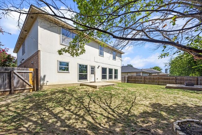 Back of house featuring a lawn, a fenced backyard, and brick siding | Image 28
