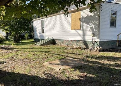 View of home's exterior with a lawn | Image 2