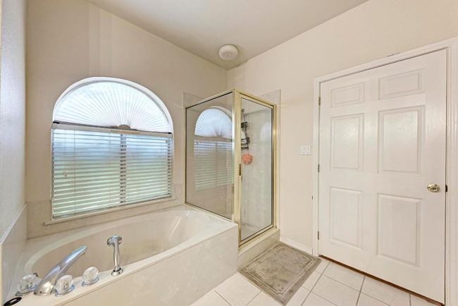 Full bath with a bath, a shower stall, and tile patterned​​‌​​​​‌​​‌‌​‌‌​​​‌‌​​‌‌​‌​​​​​‌ floors | Image 26