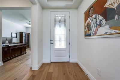 Doorway to outside with light wood flooring | Image 3