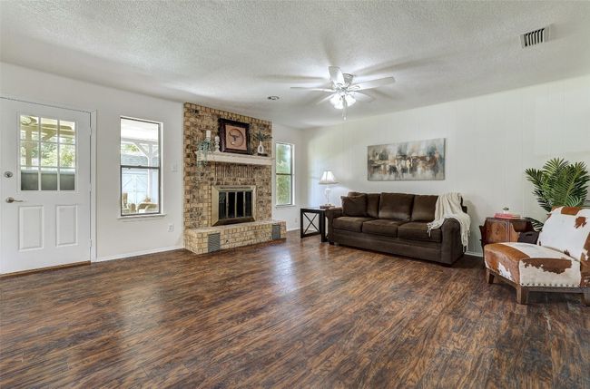 Open spacious family room; wood burning fireplace | Image 6