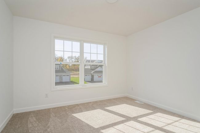 Photo is of the actual home. The main level bedroom. | Image 9
